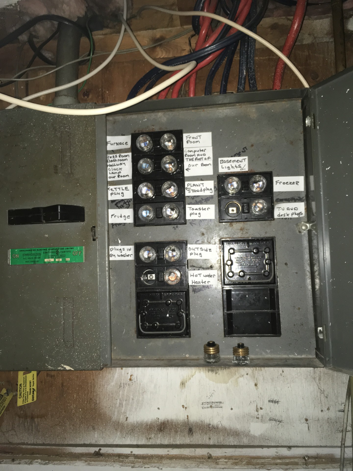 Older fuse panel with hand-labelled circuits, the kind of wiring Bay Road Electrical assesses and upgrades